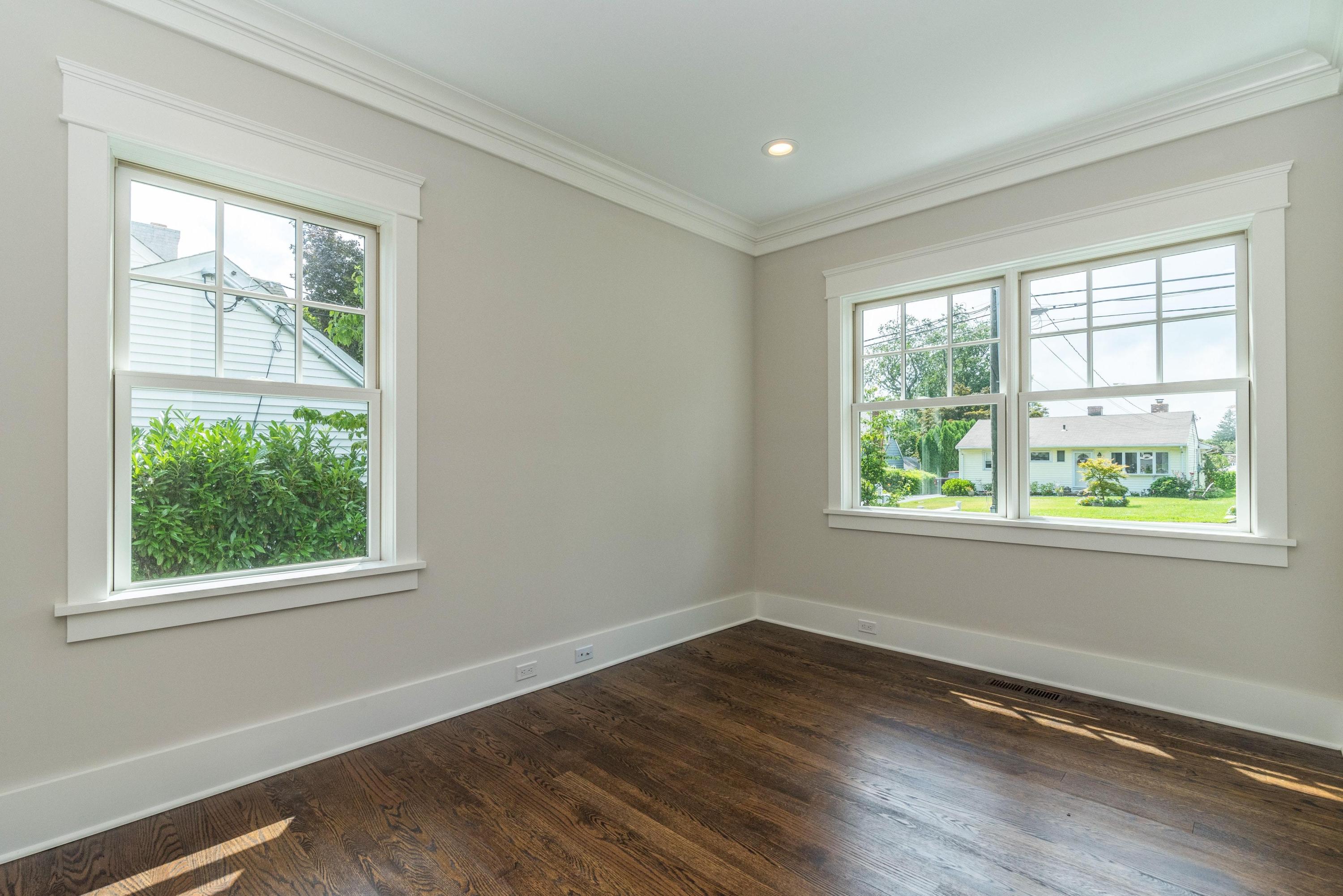 37 Ridgeley Street Darien, CT 06820 - Photo 17 of 24 an empty room with wooden floor and windows