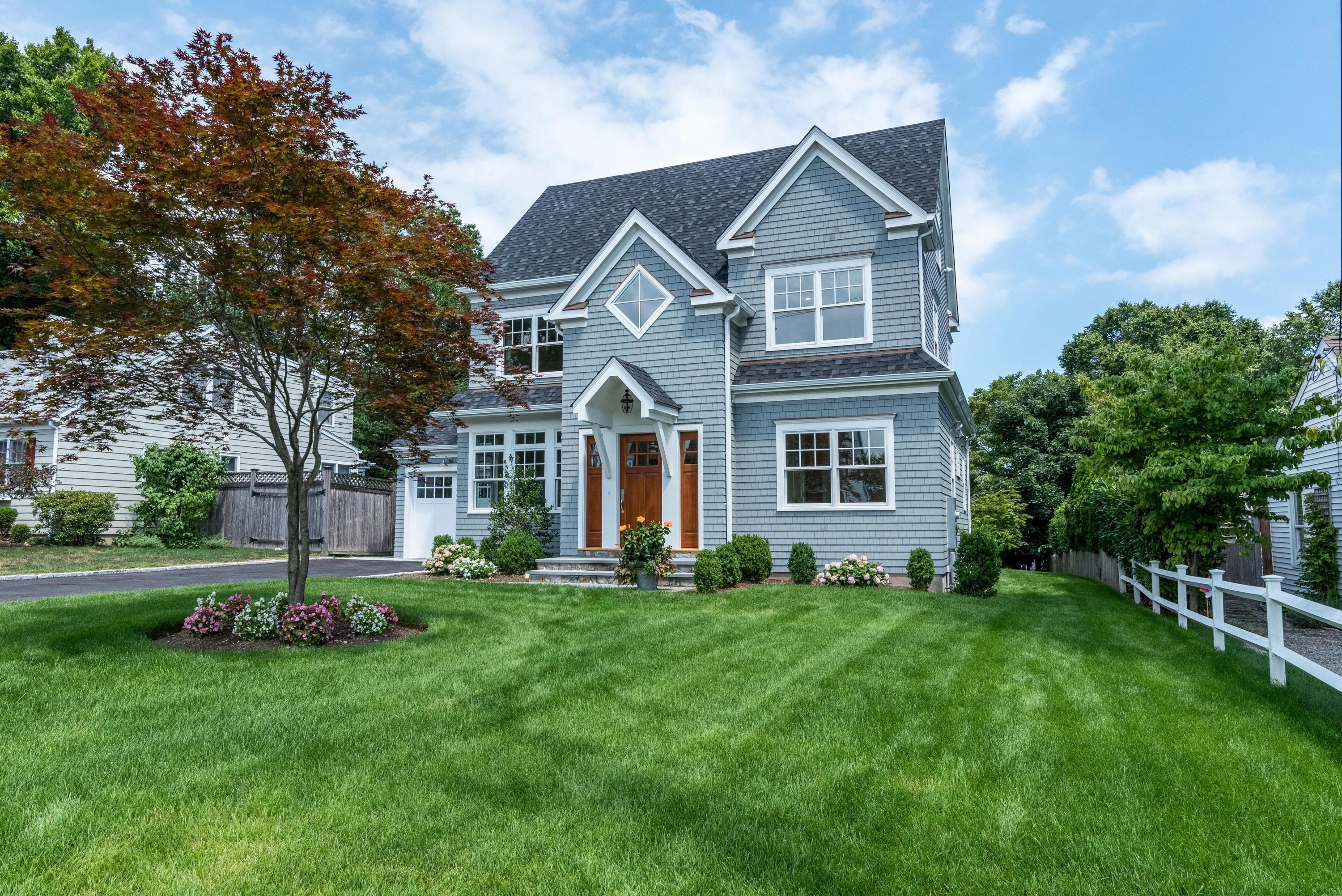 37 Ridgeley Street Darien, CT 06820 - Photo 24 of 24 a front view of a house with a yard
