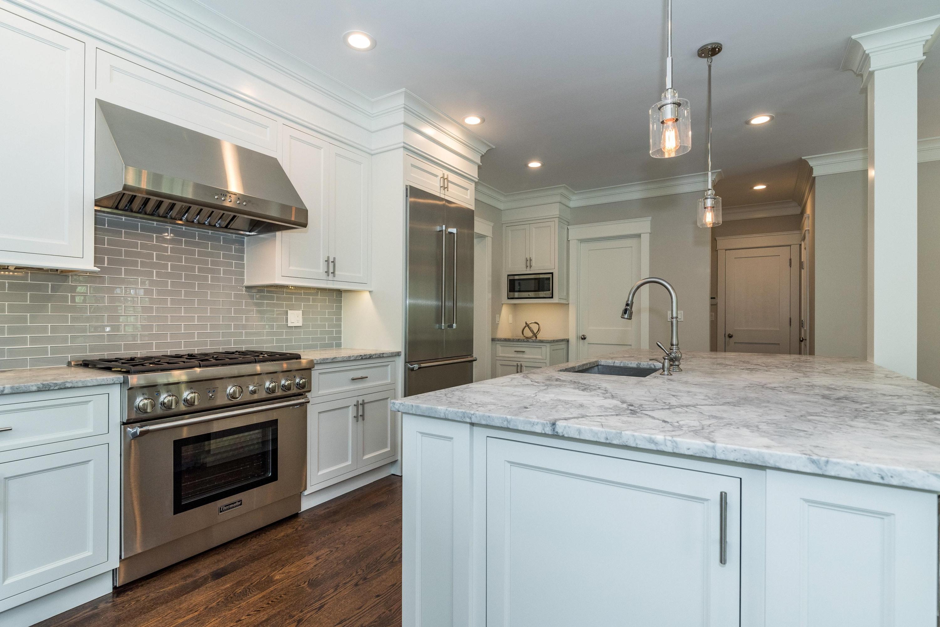 37 Ridgeley Street Darien, CT 06820 - Photo 4 of 24 a kitchen with stainless steel appliances granite countertop a stove and a sink