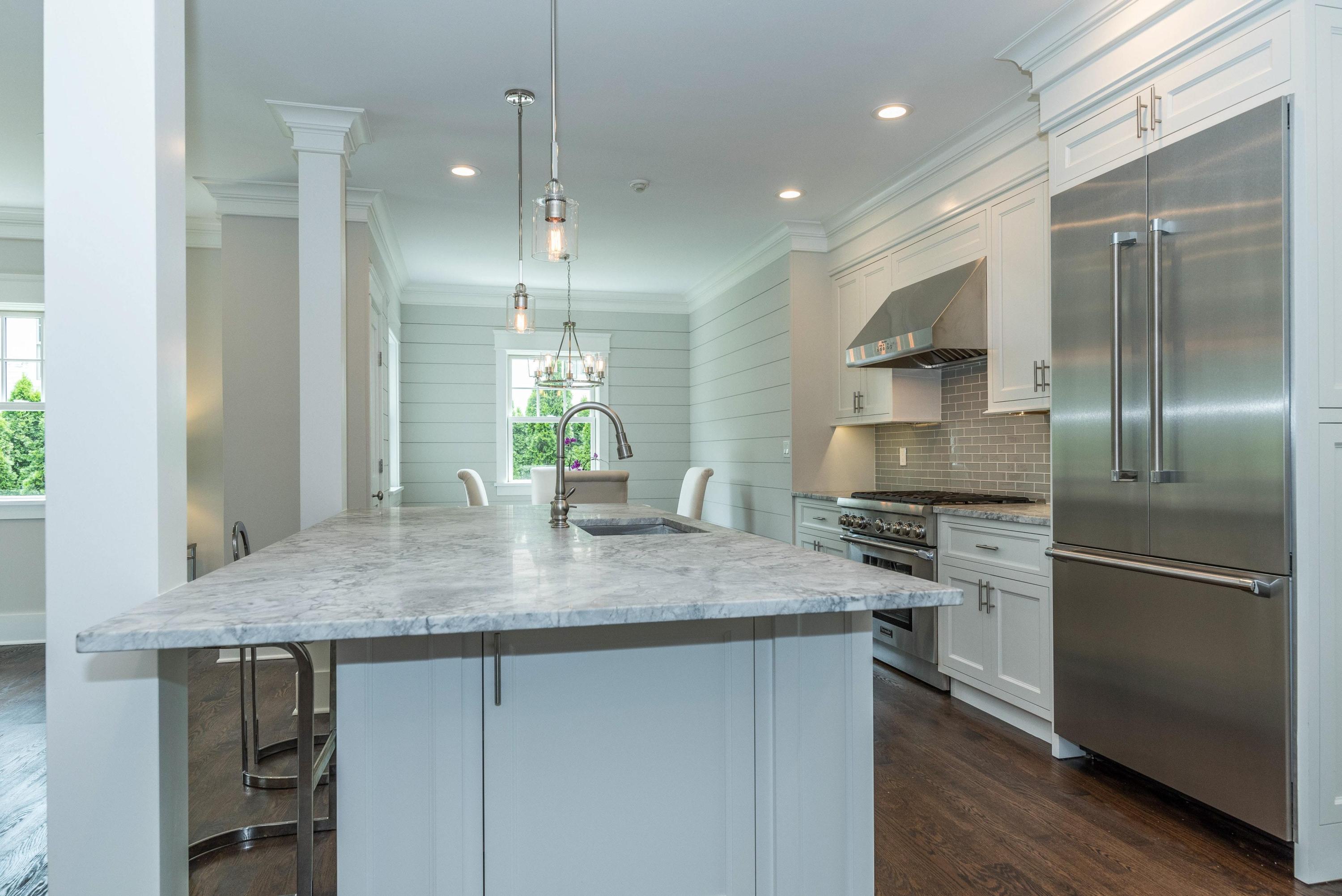 37 Ridgeley Street Darien, CT 06820 - Photo 5 of 24 a kitchen with kitchen island a counter top space cabinets and stainless steel appliances