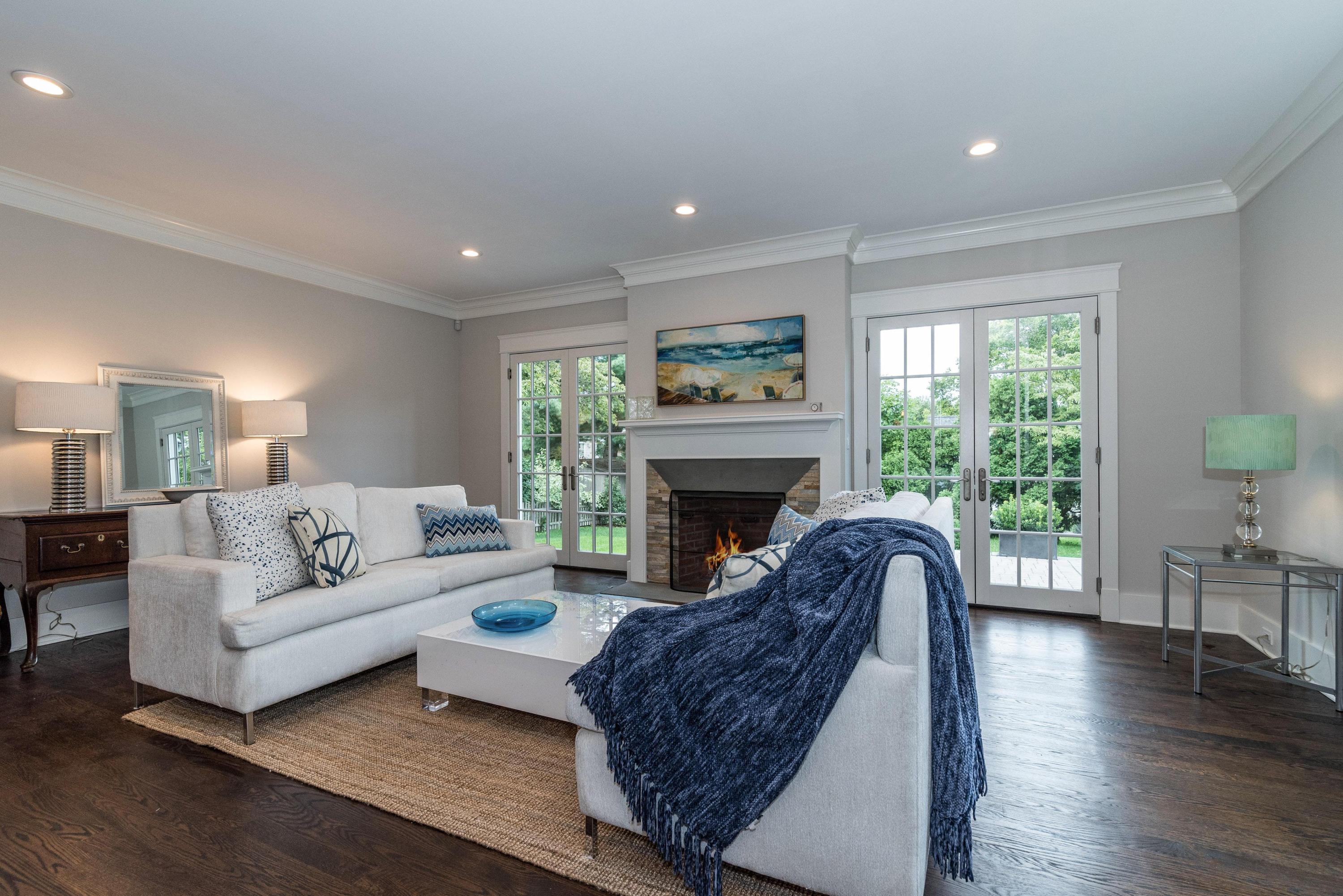 37 Ridgeley Street Darien, CT 06820 - Photo 7 of 24 a living room with furniture and a fireplace