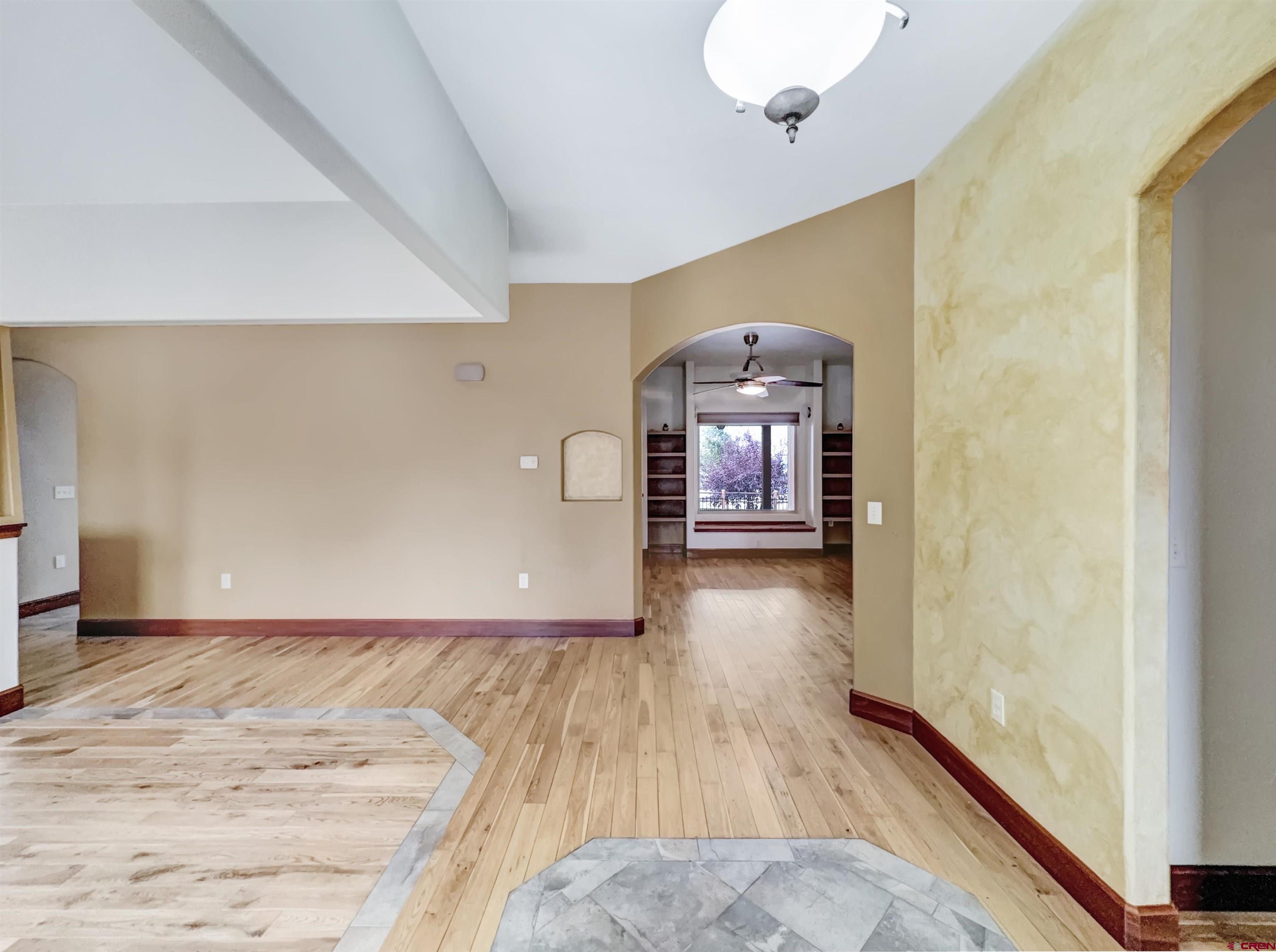1794 Roubideau Street Delta, CO 81416 - Photo 12 of 35 a view of a room with wooden floor pool table and windows
