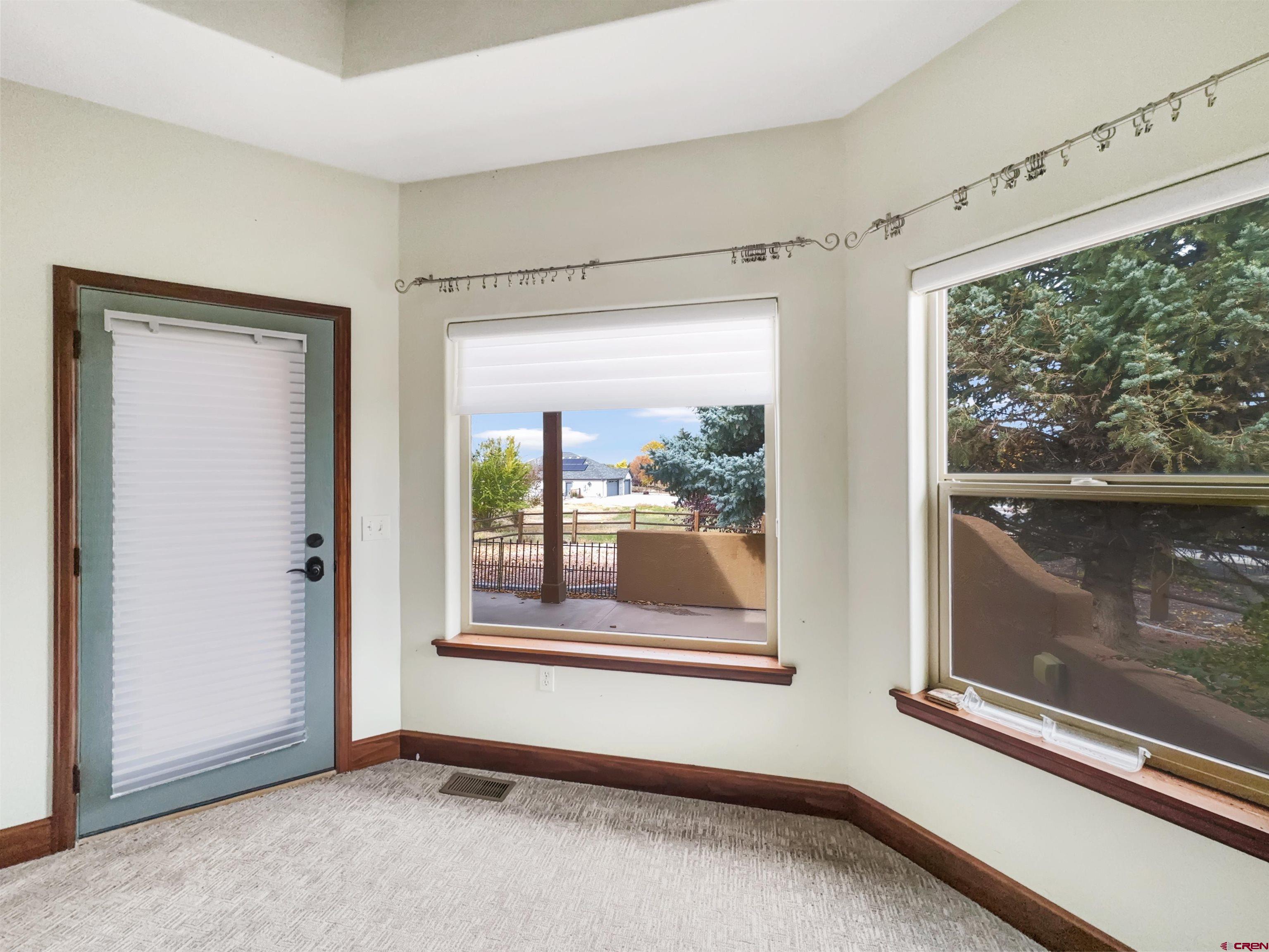 1794 Roubideau Street Delta, CO 81416 - Photo 13 of 35 a view of an empty room with a window