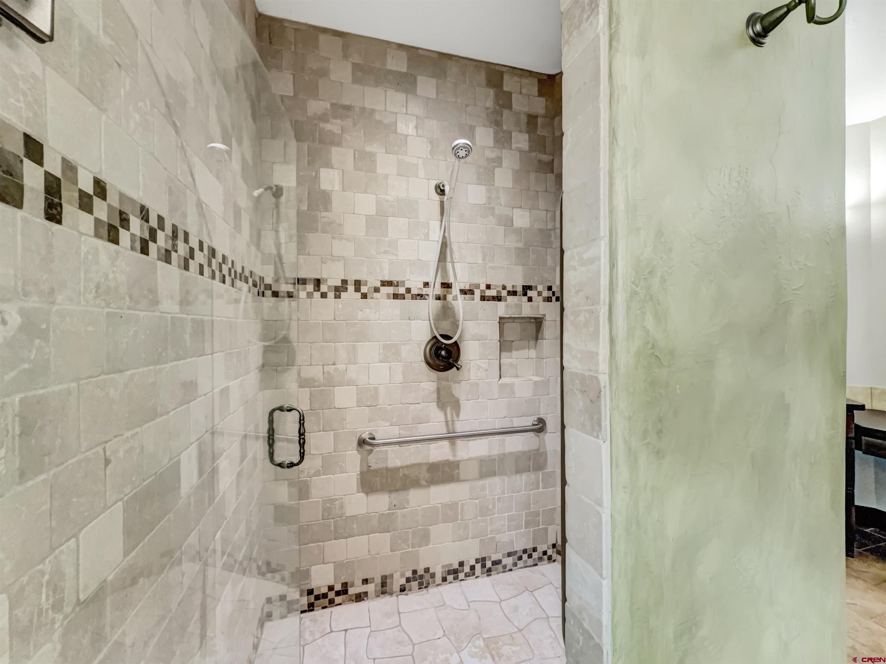 1794 Roubideau Street Delta, CO 81416 - Photo 16 of 35 a bathroom with a shower