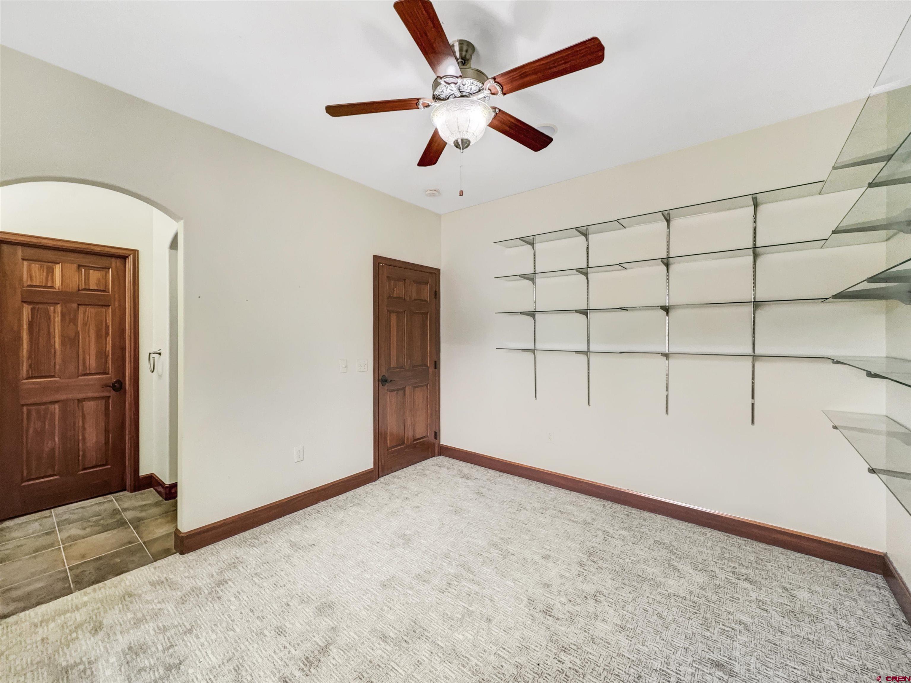 1794 Roubideau Street Delta, CO 81416 - Photo 19 of 35 a view of a livingroom with a ceiling fan and window