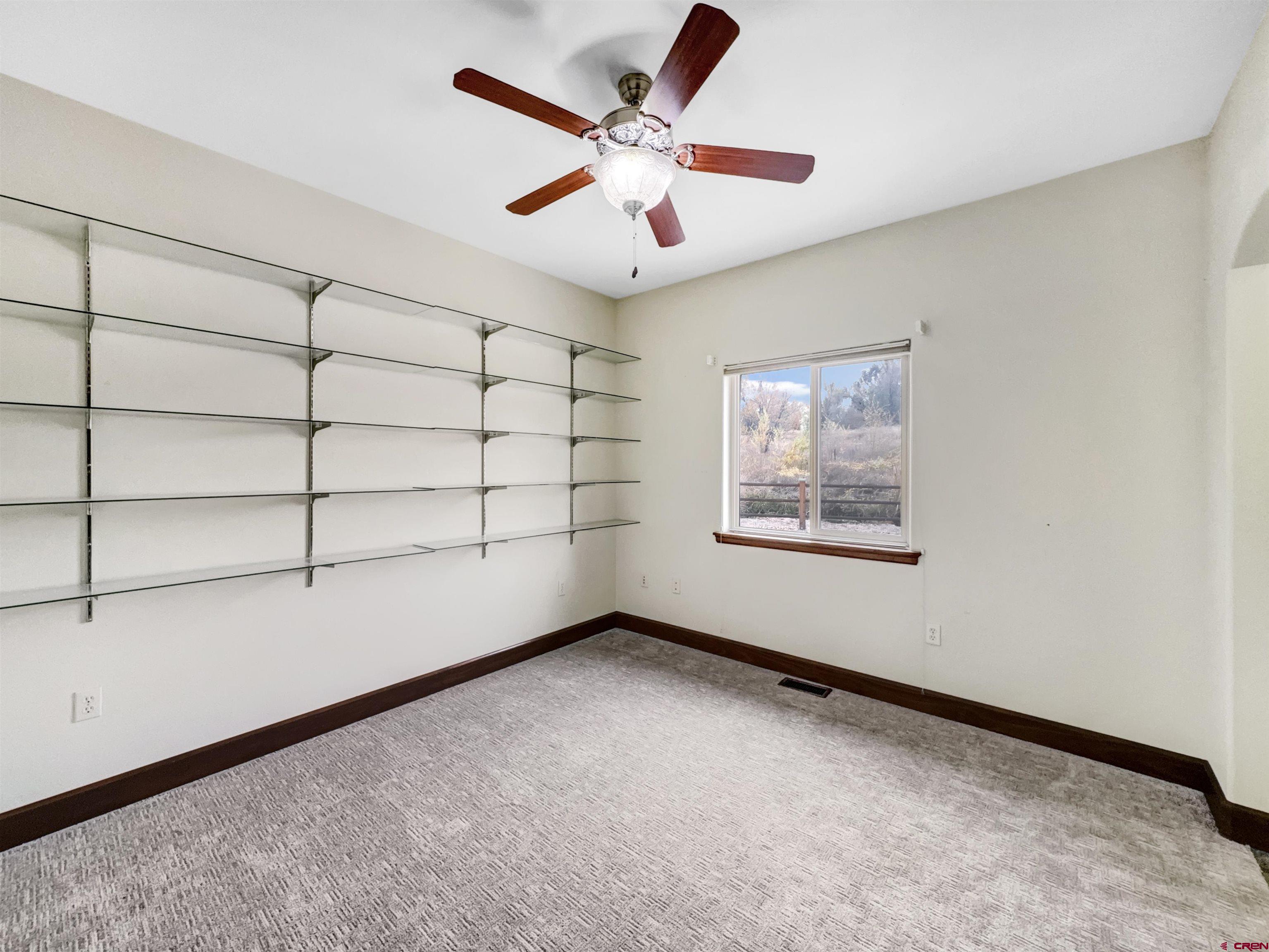 1794 Roubideau Street Delta, CO 81416 - Photo 20 of 35 a view of an empty room with a window