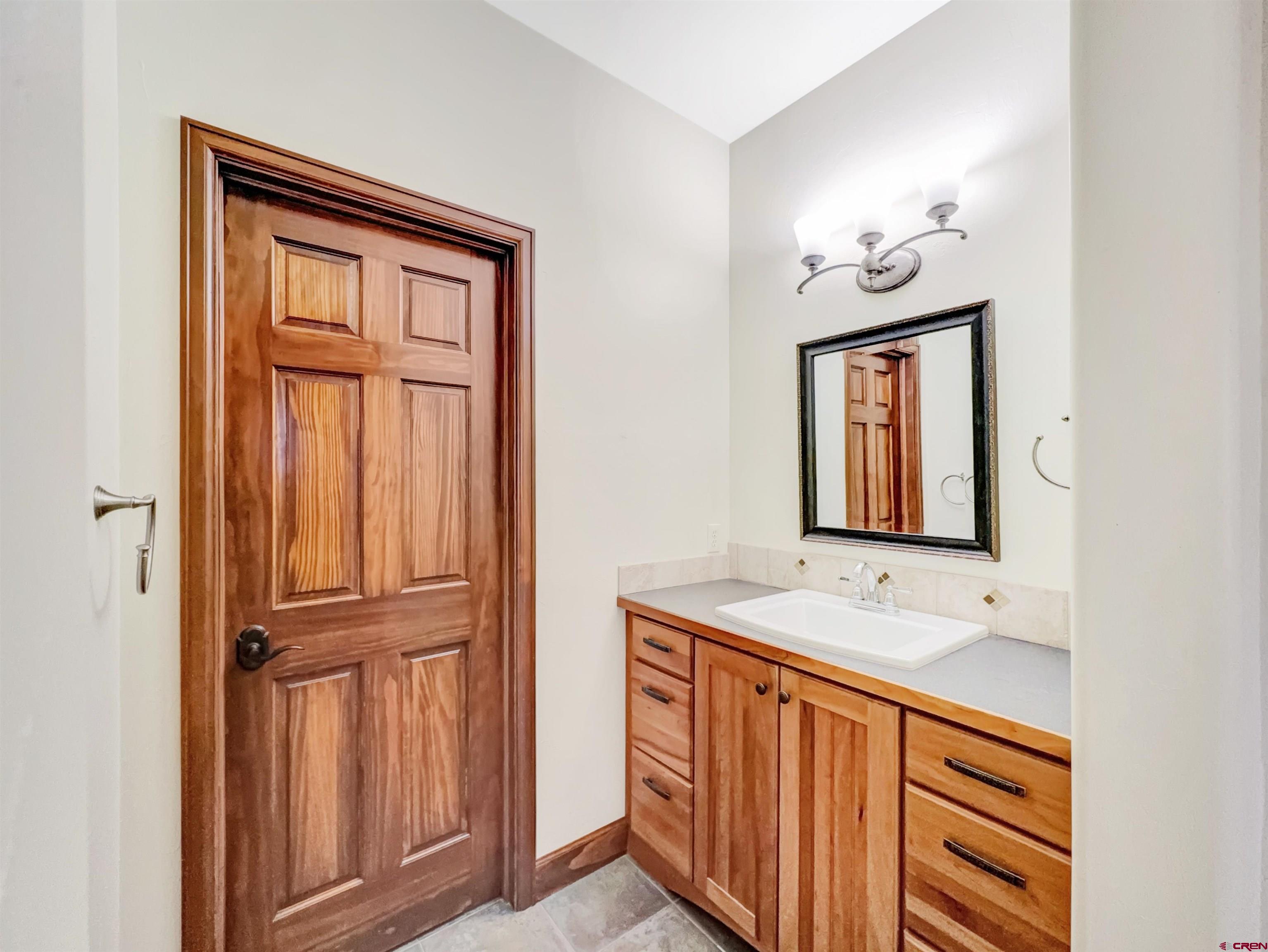 1794 Roubideau Street Delta, CO 81416 - Photo 22 of 35 a view of front door with hallway
