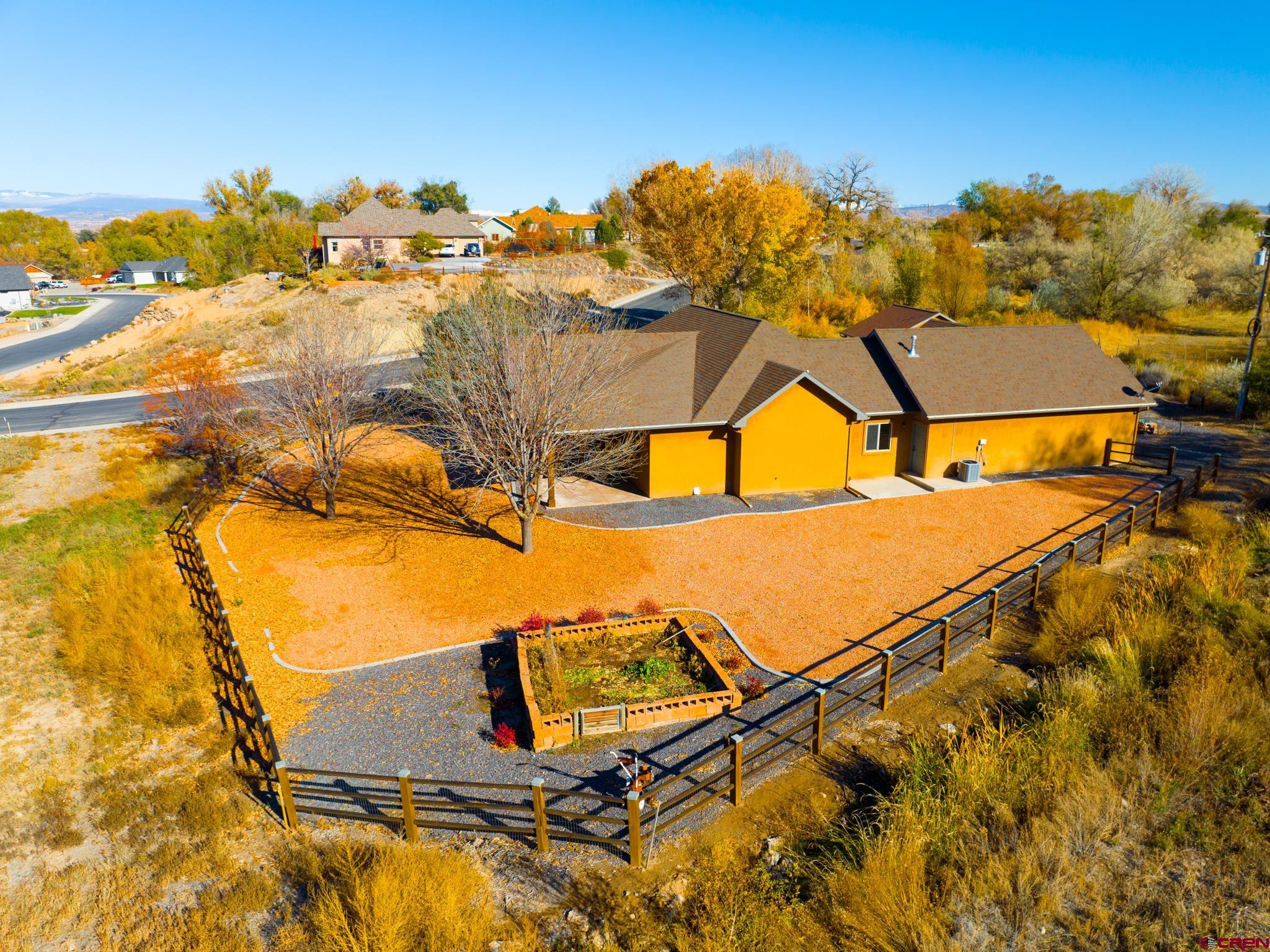 1794 Roubideau Street Delta, CO 81416 - Photo 29 of 35 an aerial view of residential houses with outdoor space
