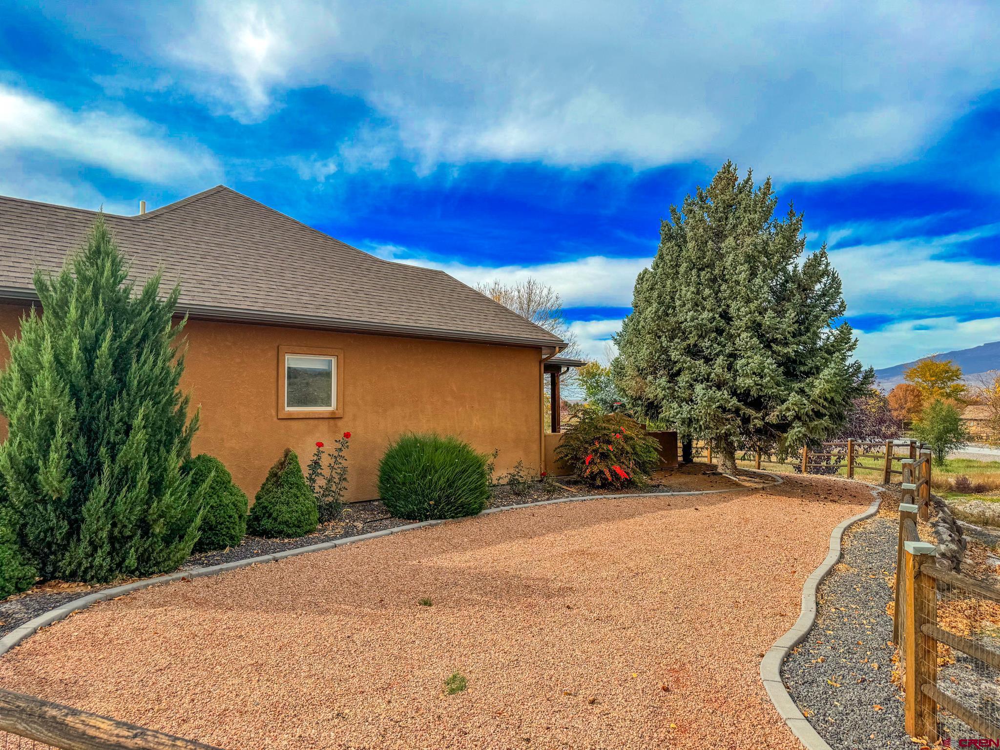 1794 Roubideau Street Delta, CO 81416 - Photo 31 of 35 a view of a house with a yard