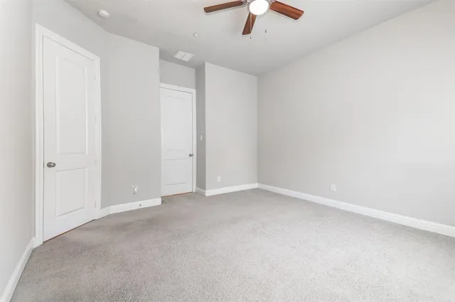 a view of a kitchen with wooden floor and electronic appliances