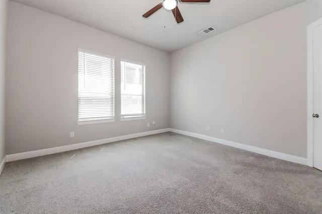 a view of a kitchen with a dishwasher and a kitchen island