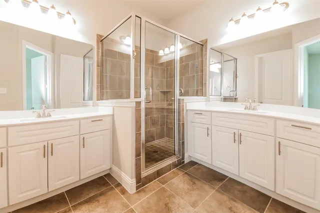 a kitchen with stainless steel appliances a sink and a refrigerator
