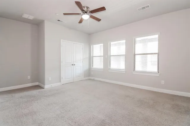 a kitchen with kitchen island a sink stove and refrigerator