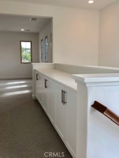 67 Tundra Irvine, CA 92602 - Photo 14 of 30 a bathroom with a sink a mirror and a window