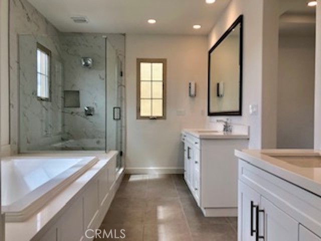 67 Tundra Irvine, CA 92602 - Photo 22 of 30 a bathroom with a sink a toilet and shower