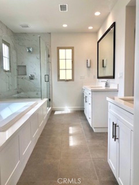 67 Tundra Irvine, CA 92602 - Photo 23 of 30 a large spacious bathroom with a large tub shower and sink