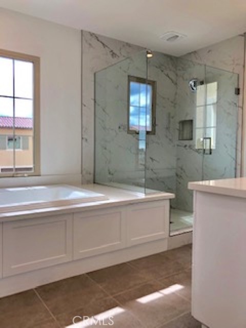 67 Tundra Irvine, CA 92602 - Photo 25 of 30 a bathroom with a bathtub and a sink