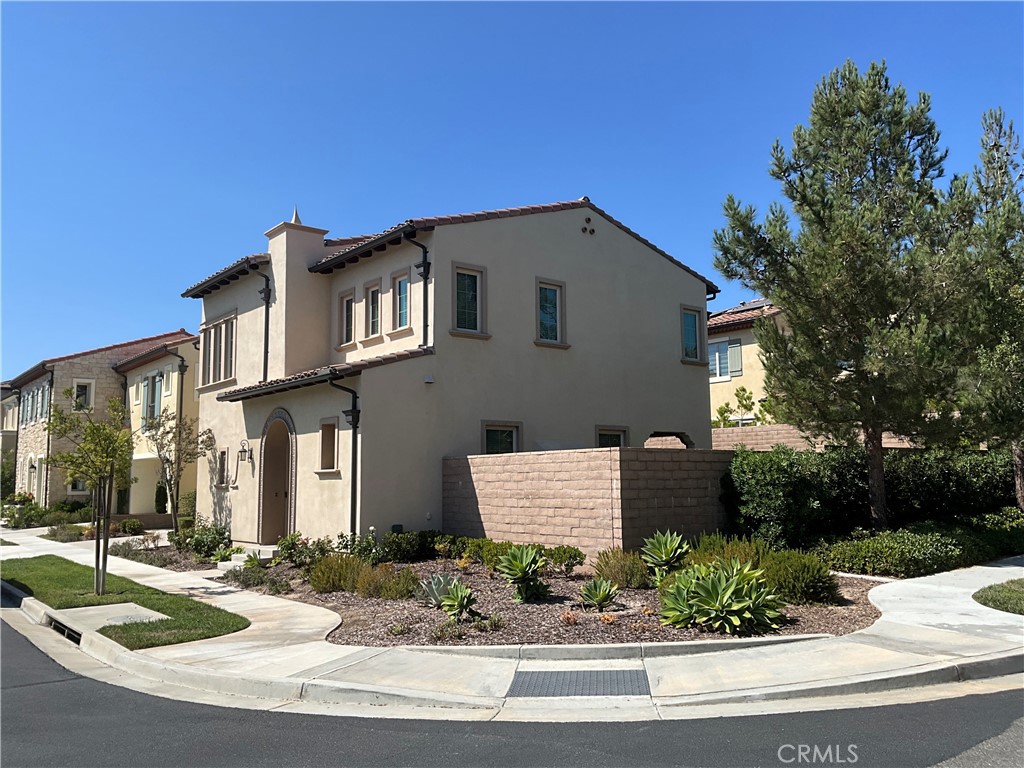 67 Tundra Irvine, CA 92602 - Photo 3 of 30 a front view of a house with garden