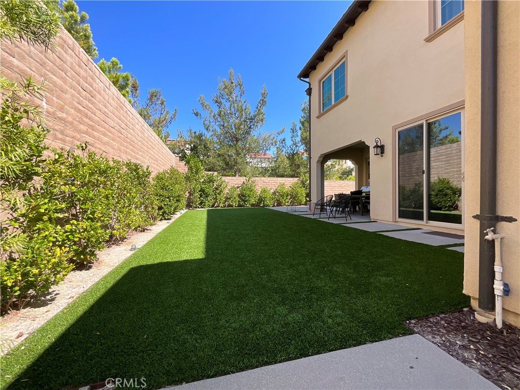 67 Tundra Irvine, CA 92602 - Photo 5 of 30 a view of a house with a yard and a garden
