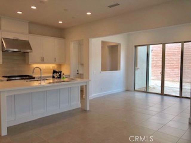 67 Tundra Irvine, CA 92602 - Photo 9 of 30 a kitchen with stainless steel appliances granite countertop a sink and cabinets