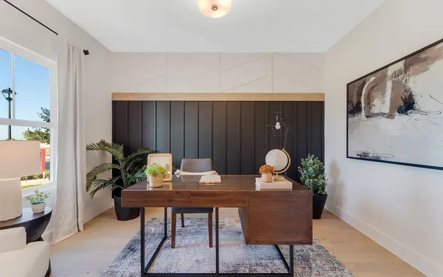 a workspace with furniture and window