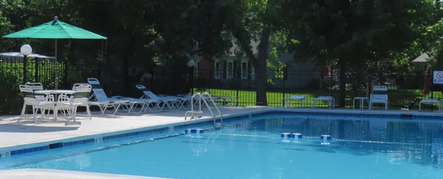 a view of swimming pool with outdoor seating