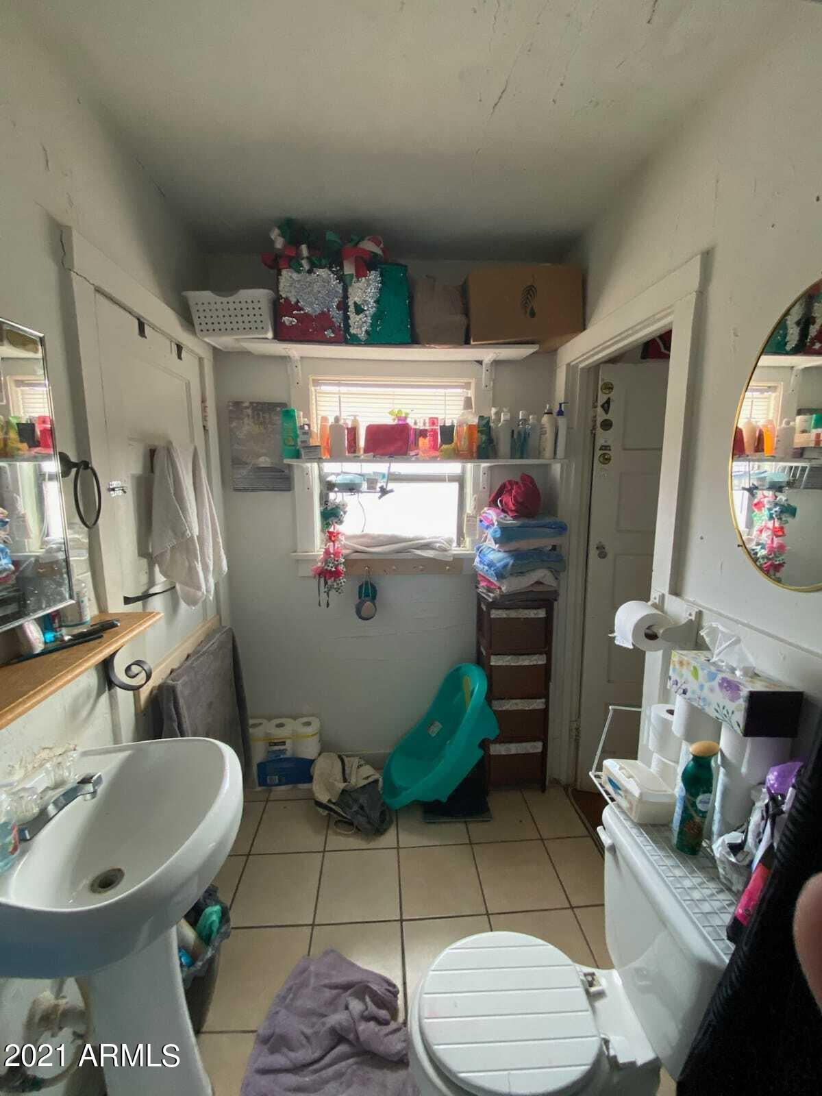 2106 North Cougar Place Douglas, AZ 85607 - Photo 16 of 16 2106 Cougar white bathroom