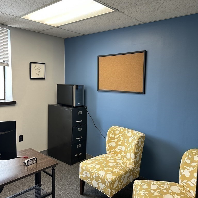 10 Tower Pk Drive, Unit 410 Woburn, MA 01801 - Photo 12 of 23 a living room with furniture and a flat screen tv