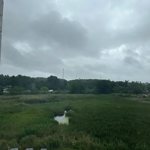 a view of a car parked on the side of the road