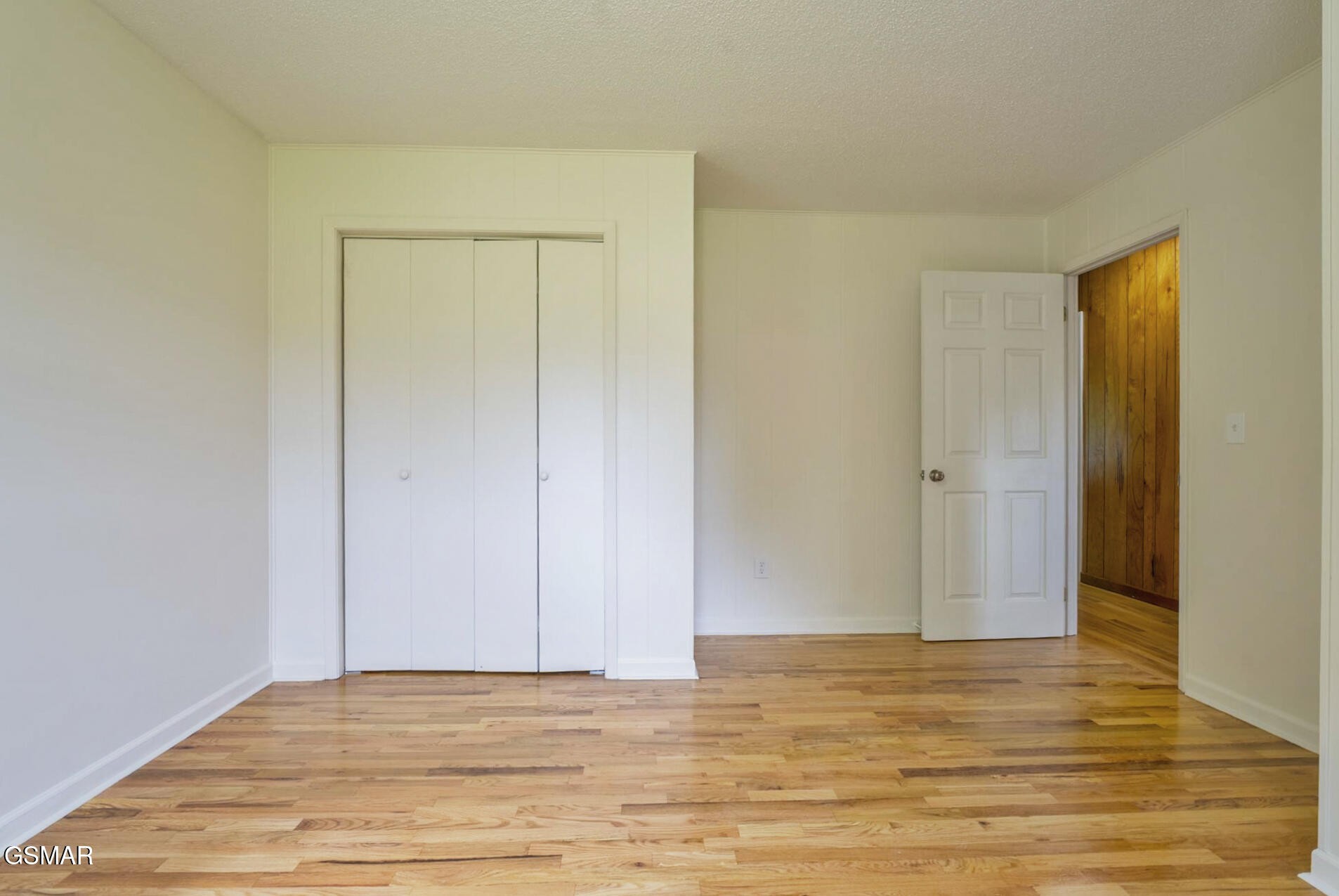 4405 Pearl Valley Road Sevierville, TN 37876 - Photo 16 of 39 a view of an empty room with wooden floor and closet