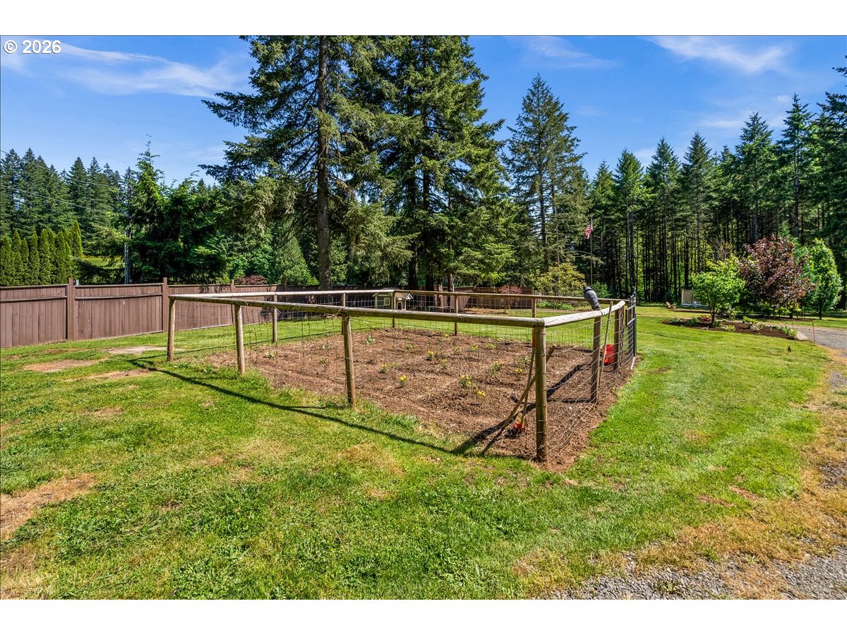 28311 Northwest Nowakowski Road Buxton, OR 97109 - Photo 46 of 48 a view of a backyard with a garden