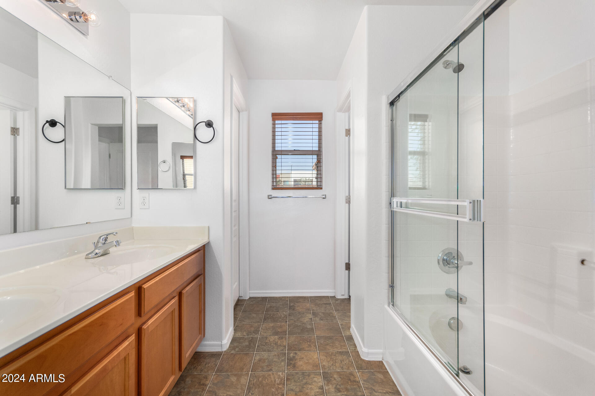 451 South Hawes Road, Unit 68 Mesa, AZ 85208 - Photo 17 of 30 a bathroom with a tub sink and mirror