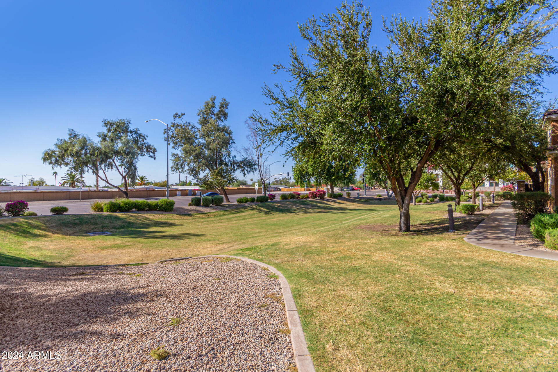 451 South Hawes Road, Unit 68 Mesa, AZ 85208 - Photo 28 of 30 a view of swimming pool with trees