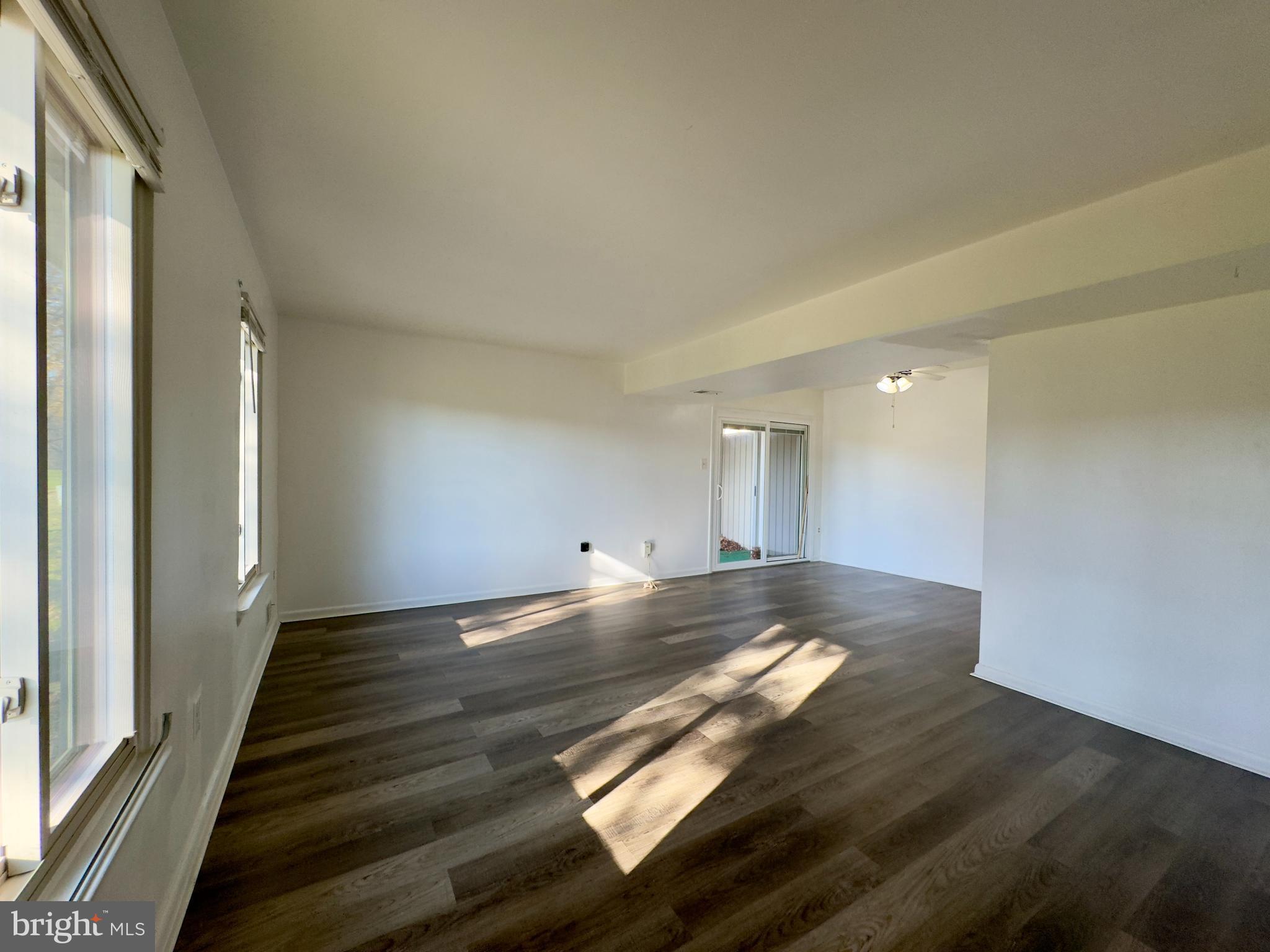 8 King Henry Circle Baltimore, MD 21237 - Photo 2 of 10 a view of wooden floor and windows in a room