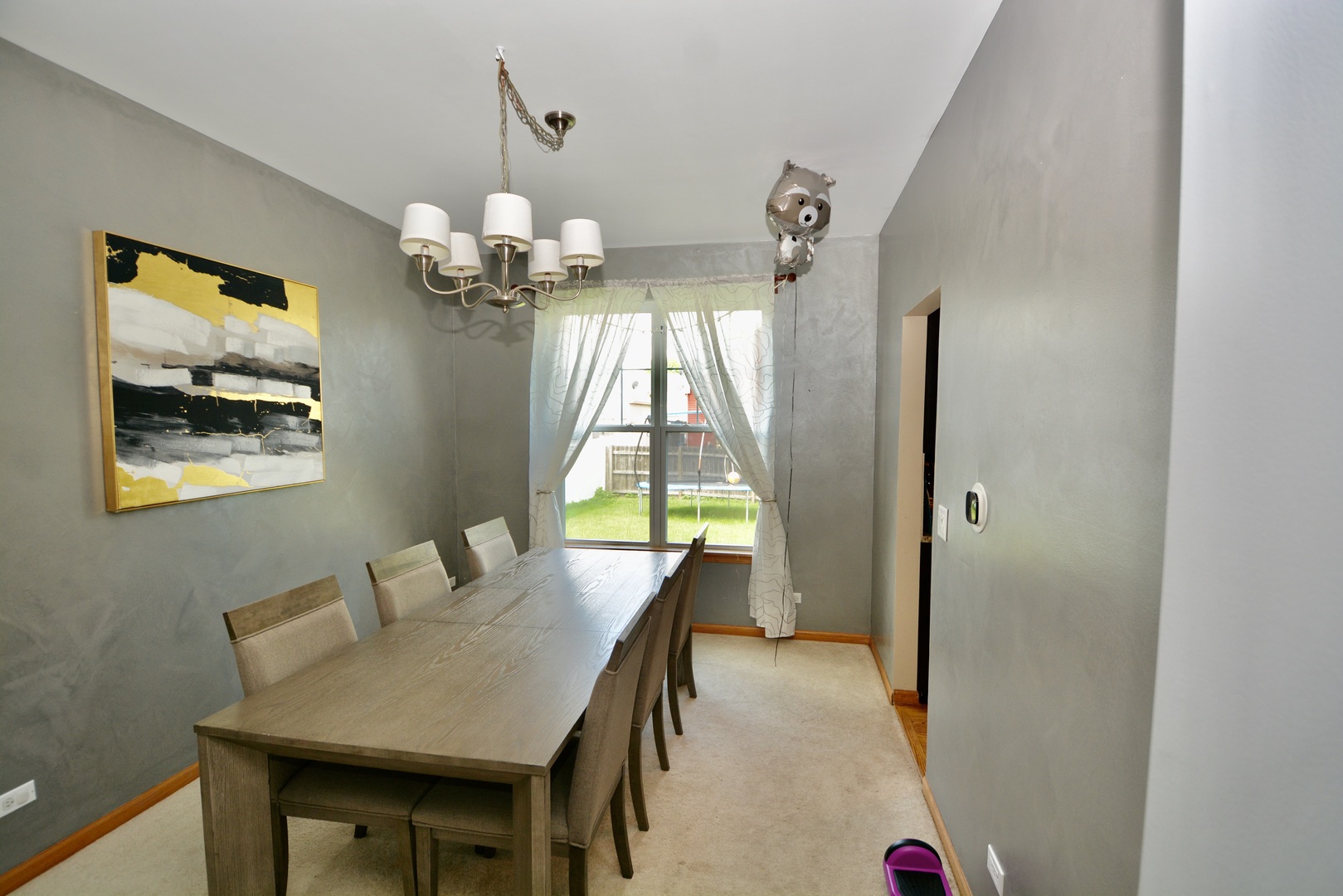 1699 Kautz Road Aurora, IL 60504 - Photo 4 of 19 a dining room with wooden floor a chandelier a wooden table and chairs