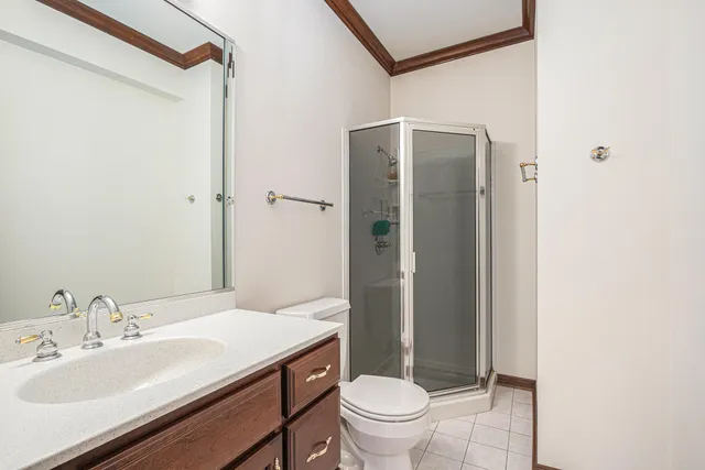 a view of a hallway with workspace and a window