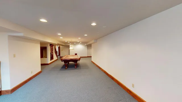 a view of backyard with outdoor seating and plants