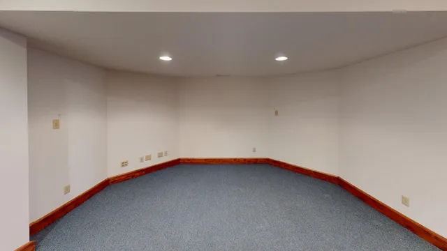 a view of a house with swimming pool and sitting area