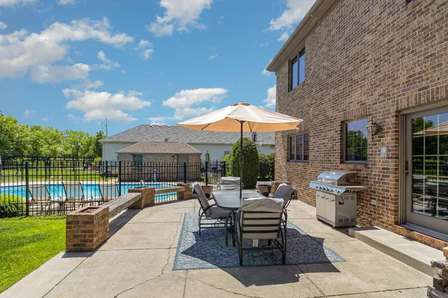 a view of a house with a yard porch and sitting area