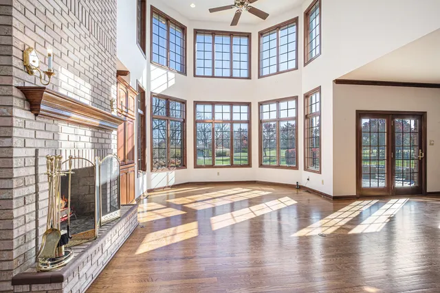 a view of an entryway with wooden floor and a window