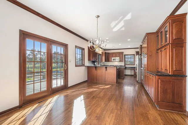 a view of kitchen with furniture and wooden floor