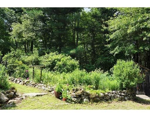 54 Breakneck Road Sturbridge, MA 01566 - Photo 32 of 35 a view of a garden with a tree