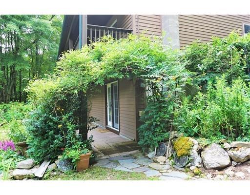 54 Breakneck Road Sturbridge, MA 01566 - Photo 33 of 35 a backyard of a house with lots of green space