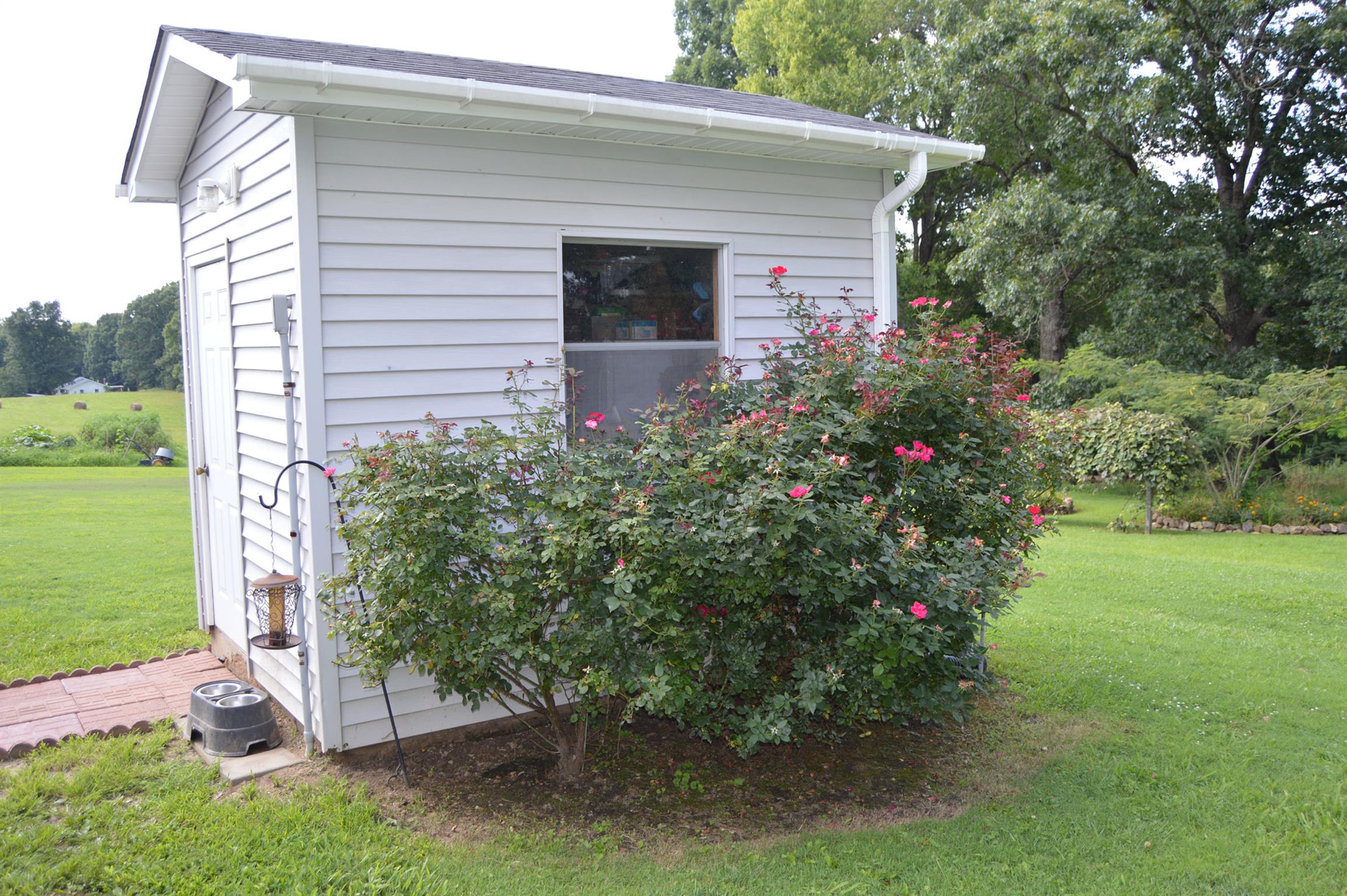 1434 Old Stewart Road Tennessee Ridge, TN 37178 - Photo 11 of 21 a front view of a house with garden
