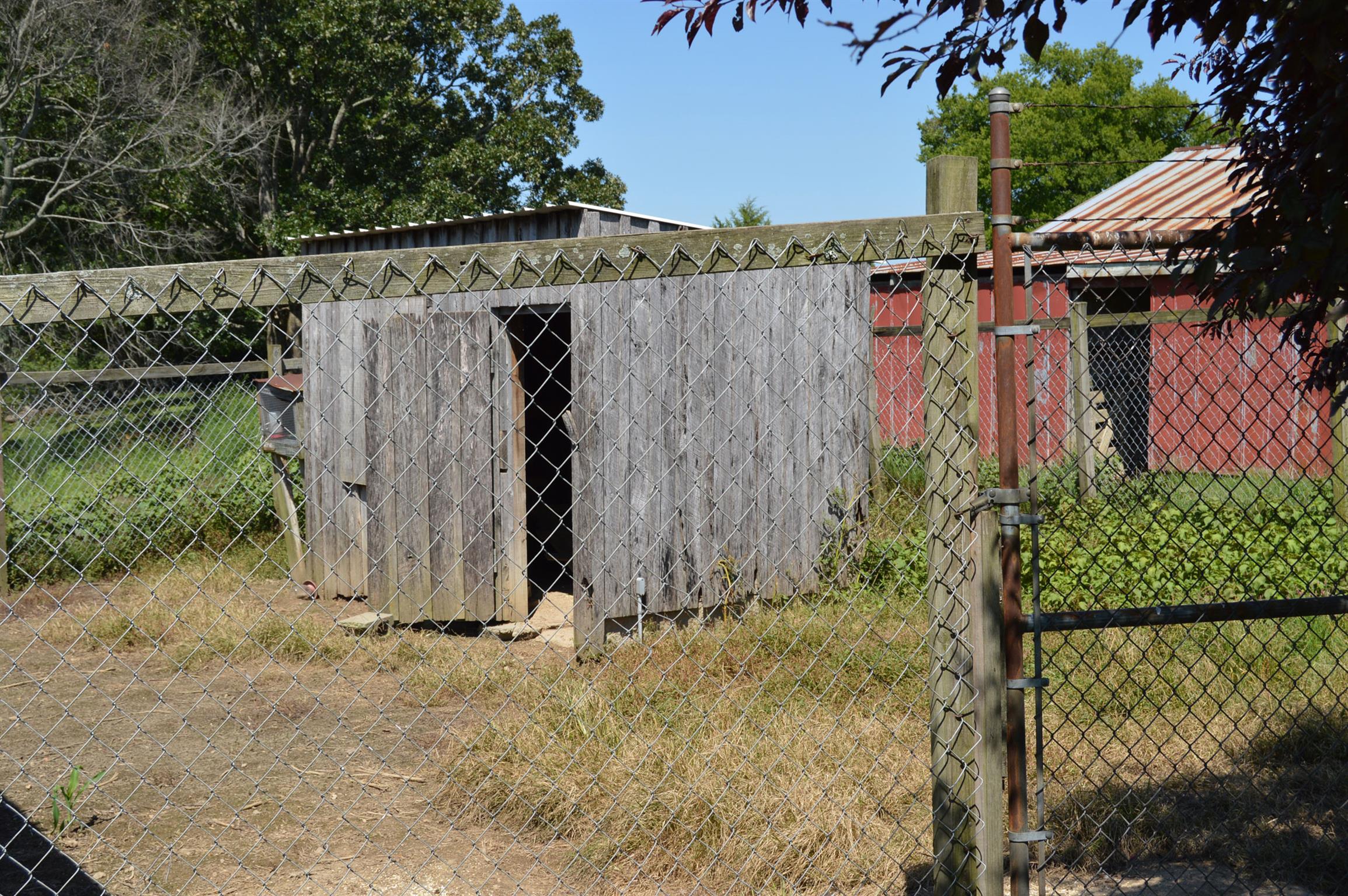 1434 Old Stewart Road Tennessee Ridge, TN 37178 - Photo 13 of 21 a view of a house with a wooden fence