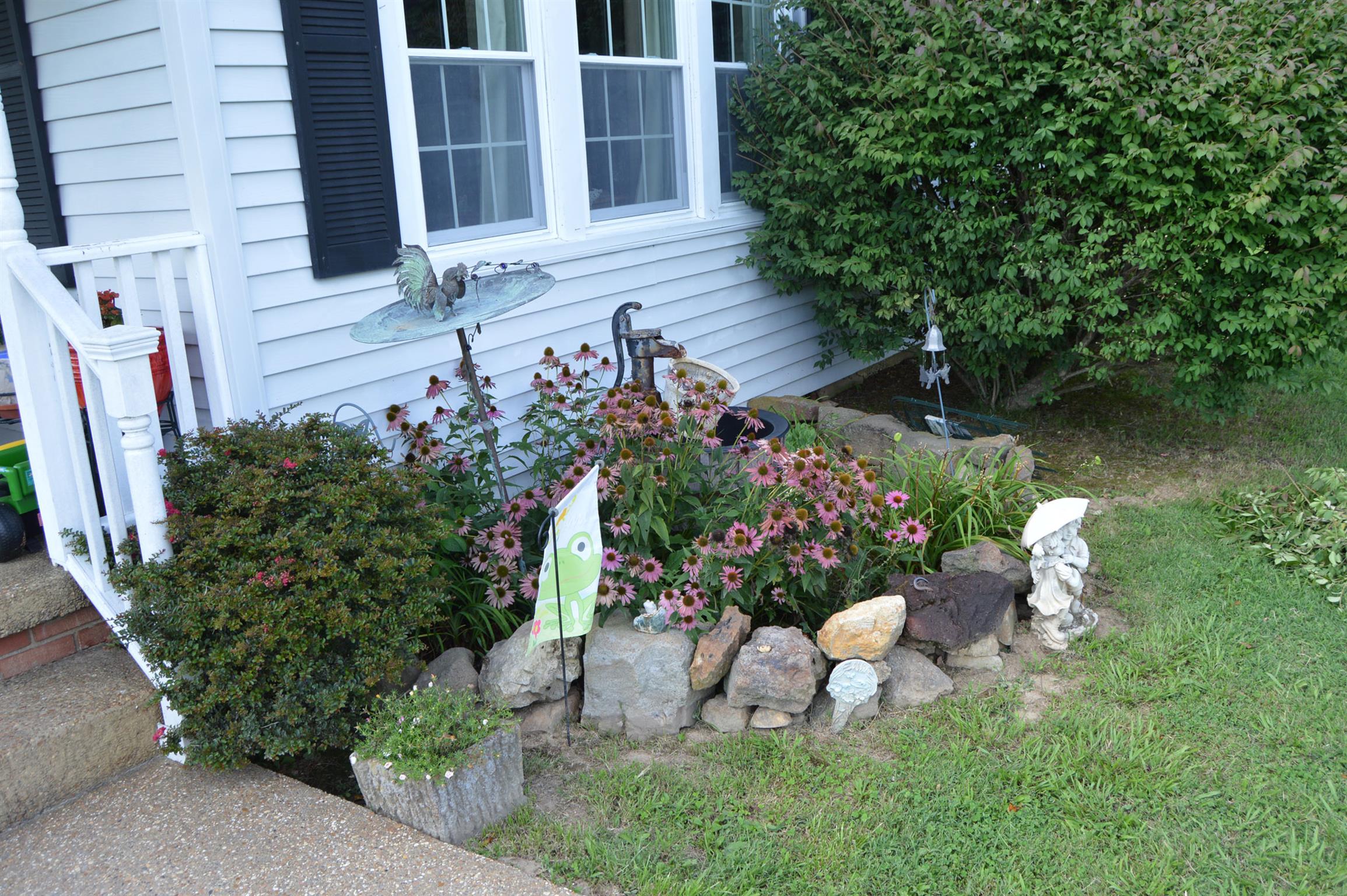1434 Old Stewart Road Tennessee Ridge, TN 37178 - Photo 21 of 21 a front view of a house with a yard and sitting area