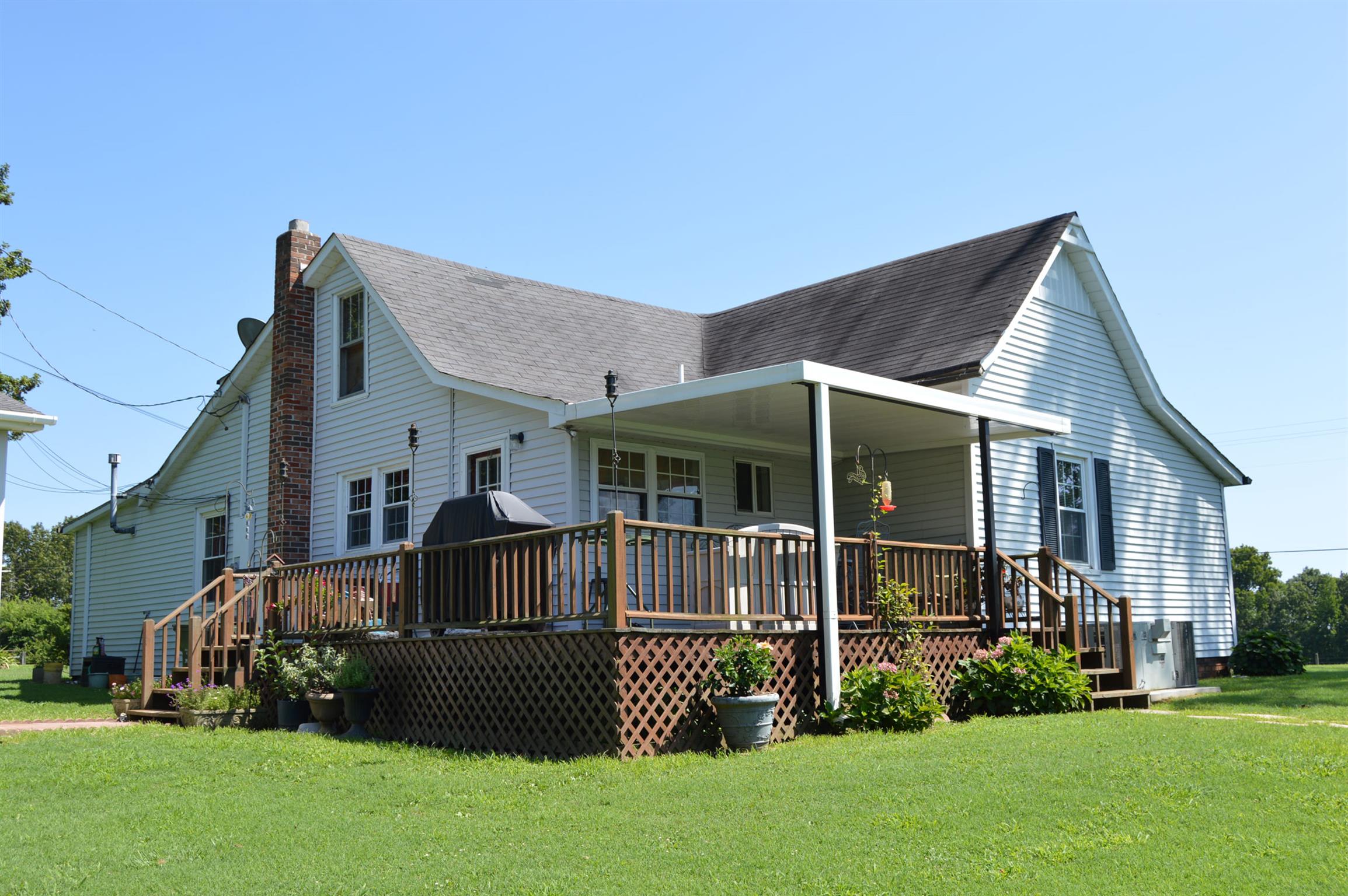 1434 Old Stewart Road Tennessee Ridge, TN 37178 - Photo 4 of 21 a front view of a house with a yard