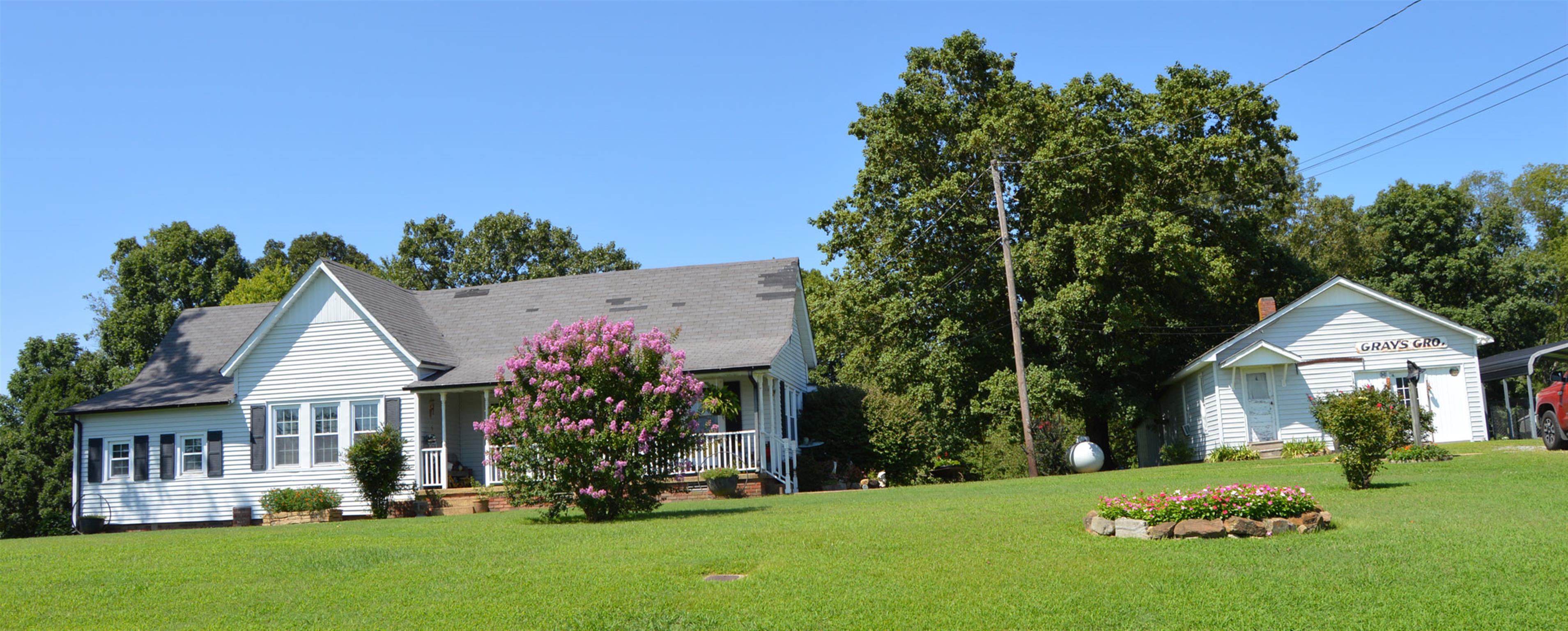 1434 Old Stewart Road Tennessee Ridge, TN 37178 - Photo 5 of 21 a front view of a house with a garden