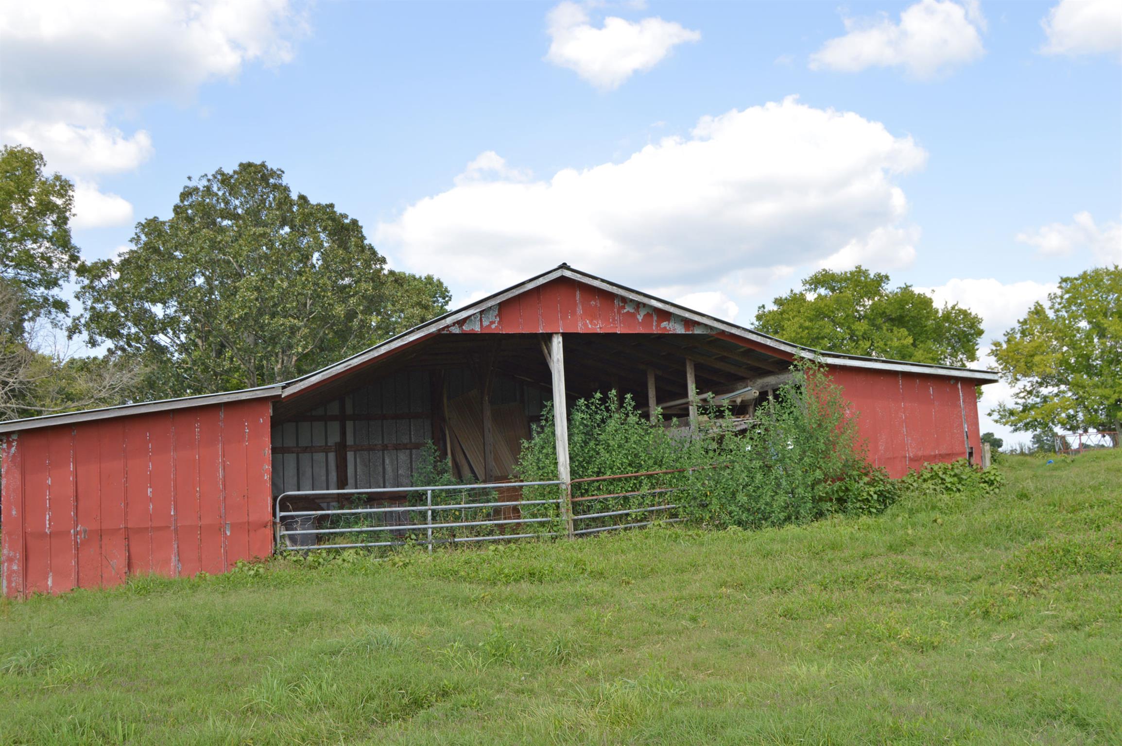 1434 Old Stewart Road Tennessee Ridge, TN 37178 - Photo 10 of 21 a backyard of a house with lots of green space