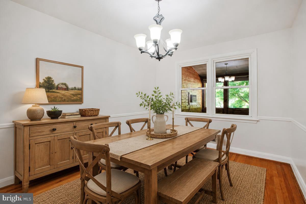 1016 Winsford Road Towson, MD 21204 - Photo 7 of 42 a view of a dining room with furniture and wooden floor